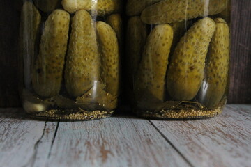 Homemade pickled cucumbers in a jar, marinade. Photo