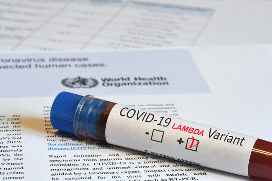 Florence, August 2021: Blood tube for test detection of virus Covid-19 Lambda Variant with positive result on papers document with logo of WHO.