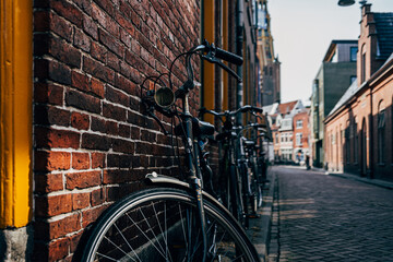 Fototapeta na wymiar old bicycle on cobblestone street in netherlands