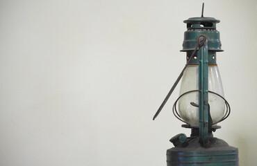 Vintage oil lamp green metallic color which also uses kerosene portrayed to bring forth and idea...