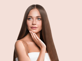 Obraz na płótnie Canvas Woman with long smooth hair breunette natural make up healthy skin manicure nails
