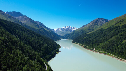 Naklejka na ściany i meble Mountain lake at Kaunertal Valley in Austria - aerial view - travel photography by drone