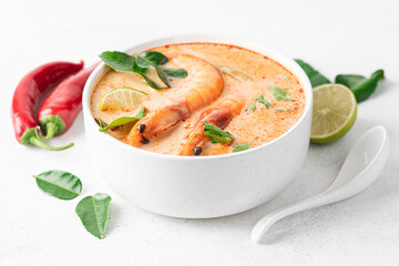 Tom Yam kung spicy Thai soup with  prawn and coconut milk. Traditional  asian spicy coconut milk soup
