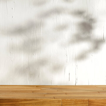 Wooden desk of free space and wall with shadows 