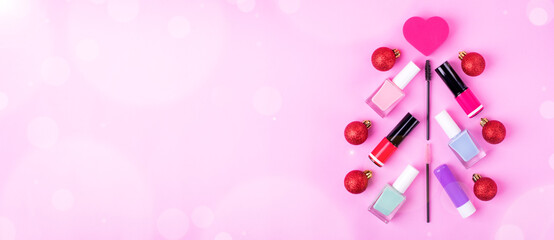 Christmas tree made of decorative cosmetics assortment on pink. Holiday shopping for make-up products. Web banner with copy space. Greeting card or sale announcement template