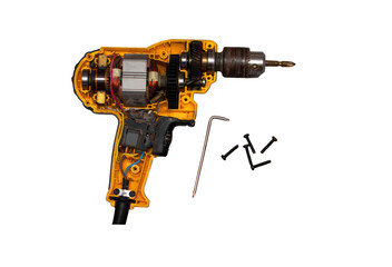 detachable used electric drill on white background The lid opens to reveal the internal components that include the motor, gear and switch.