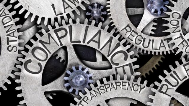 Group of rotating tooth wheels with Compliance, Regulation, Standard, Law and Rule sign imprinted on metal surface. High quality 4k video.
