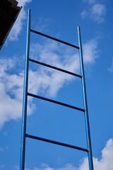 ladder to the sky,ladder reaching into a blue sky and clouds