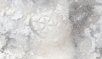 the sea coast in the form of bottom sediments flooded with seawater with the formation of salt patterns and sea lagoons in the form of textures and stone abstractions under water with shadows from the