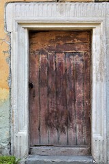 Basement entrance door in the wall of an old town house