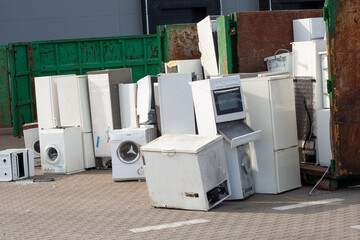 Collected and awaiting for the disposal of electronic-waste - refrigerators, washing machines and others. - obrazy, fototapety, plakaty