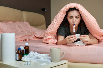 sick girl having influenza symptoms coughing at home