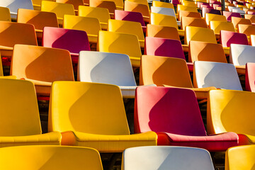 Empty plastic chairs in the stadium. © ABCDstock