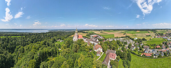 Aerial view on the Kloster Andechs Monastery and the Ammersee lake in the background