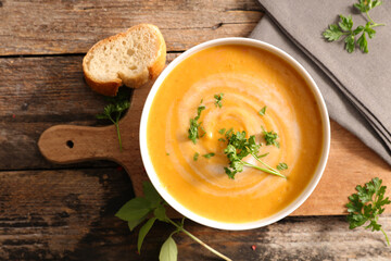 bowl of vegetable soup and herbs