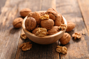 bowl of walnut on wood background