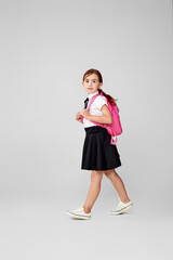 adorable schoolgirl with backpack. Back to school