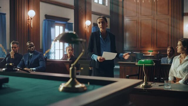 Court of Justice and Law Trial: Female Public Defender Presenting Case, Making Passionate Speech to Judge, Jury. Multiethnic Attorney Lawyer Protecting Client's Innocents with Supporting Argument.