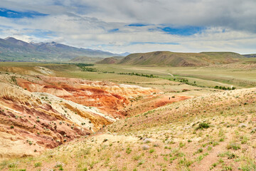 Fototapeta na wymiar red-yellow hills of an ancient relict lake in Altai