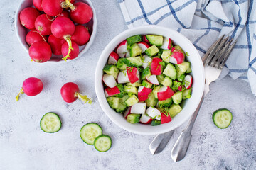 Radish cucumber parsley dill salad in a bowl
