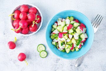 Radish cucumber parsley dill salad in a bowl