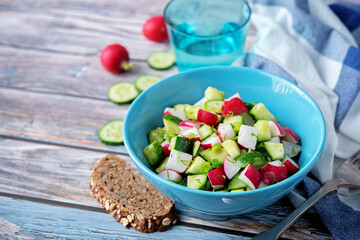 Radish cucumber parsley dill salad in a bowl