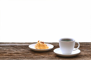black coffee in white seramic glasses and  almond caramel croissant on  wooden table
