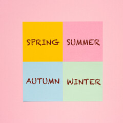 some colored sheets with the name of the four seasons