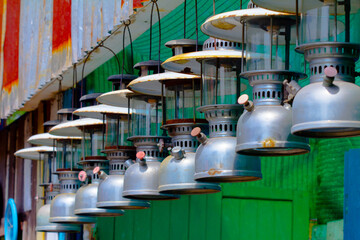 Old fashioned vintage kerosene oil lantern lamp burning, Old metal kerosene lamp on the window....