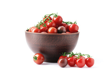 Ripe juicy cherry tomatoes in a bowl isolated on white background