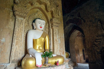 Myanmar (ex Birmanie). Bagan, Mandalay region. Seated Buddha inside a temple