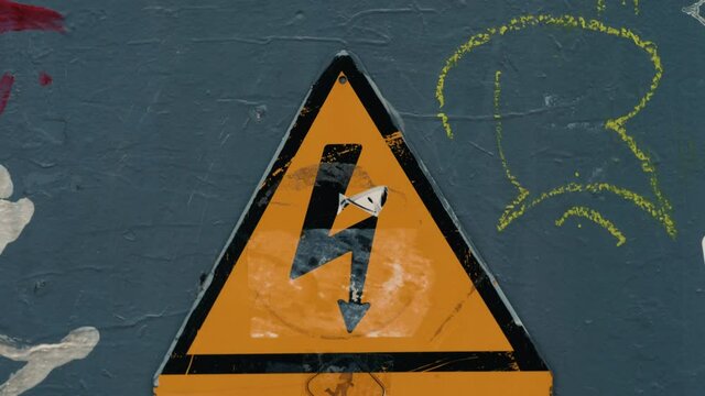 Danger high voltage sign at a train station. Danger high voltage sign at an underground station