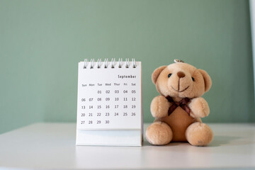 2021 Calendar desk place on table. Desktop Calender for Planner to plan agenda, timetable, appointment, organization, management each date, month, and year on wooden office table.Calendar Concept