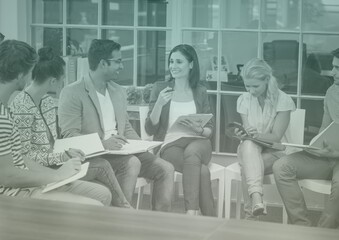 Fototapeta premium Composition of green light over business people during meeting