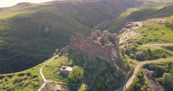 Aerial view of famous medieval ruins of Amberd fortress on a mountain among deep gorges. Travel attractions and sightseeing in Armenia