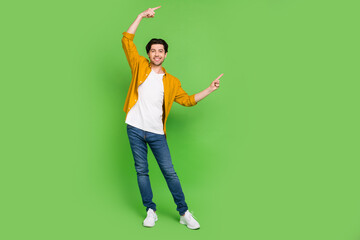 Full size photo of young handsome positive man point finger copyspace advertisement isolated on...