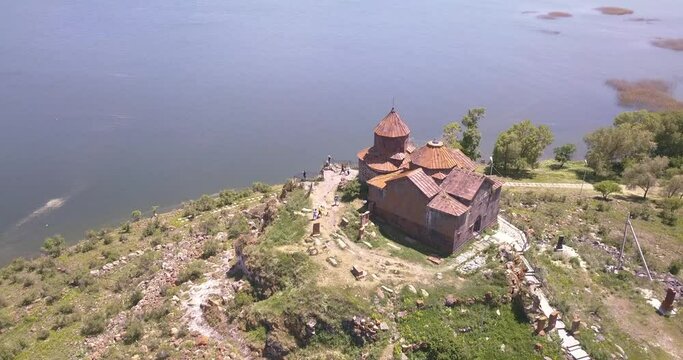 famous ancient monastery of Hayravank in Armenia with the legendary Lake Sevan. Strong contrast and film grain filter added.