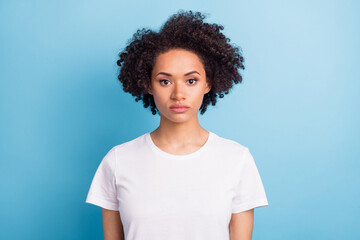 Portrait of young serious good looking gorgeous african woman wearing white t-shirt isolated on...