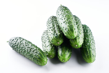 Set of fresh whole cucumbers isolated on a white background, clipping path. Garden cucumber wallpaper backdrop design