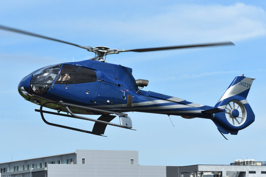 Tokyo, Japan - August 11, 2021:Shizuoka Air Commuter Eurocopter EC130B4 (JA123Y) light utility helicopter.