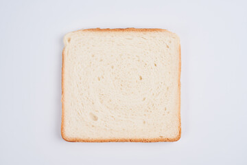One square slice of toast sandwich bread isolated on white background close up