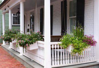 Fototapeta na wymiar Front Porch Decor, White Fence, Colorful Flower Boxes