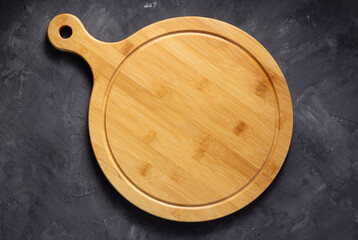 Pizza cutting board for homemade bread cooking or baking on table. Empty pizza board
