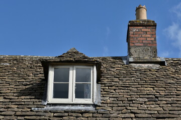 window and chimney on a roof