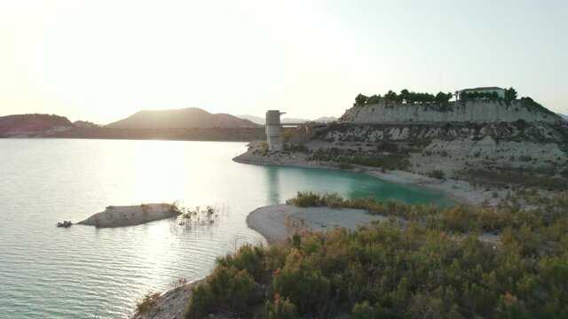 Aerial drone point of view Embalse de la Pedrera reservoir during sunset. Province of Alicante. Spain