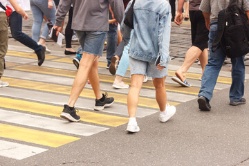 Fototapeta na wymiar pedestrians walking on a crosswalk