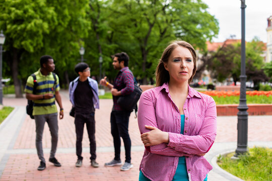 Lonely student girl being bullied by her university peers