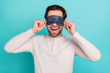 Naklejka premium Photo of young man excited close eyes sleeping mask bedtime isolated over turquoise color background