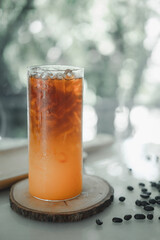 Black coffee to a layer of orange juice in the cup. Smooth taste of coffee and orange juice