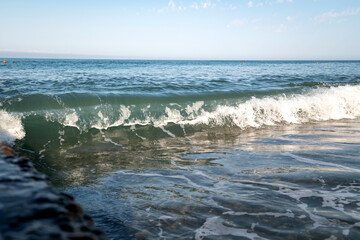 sea wave in back sunlight with place for text. Clean environment.